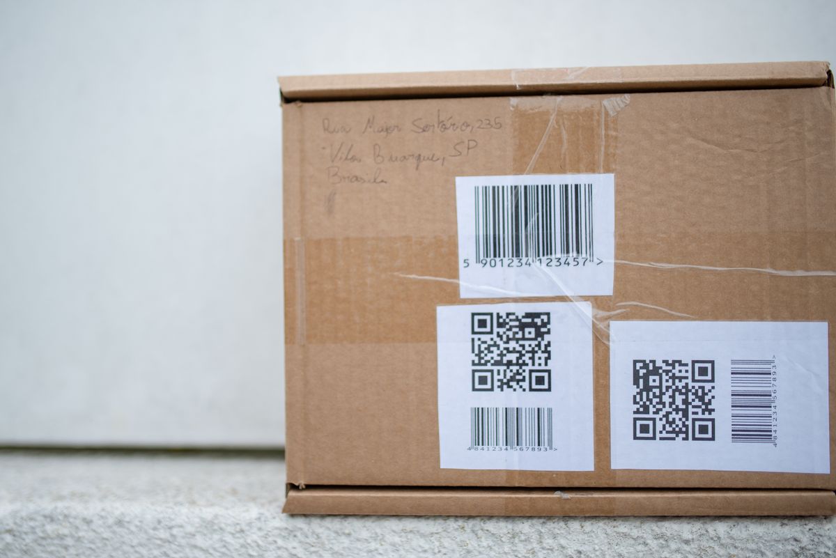 Parcel labelled with barcodes and QR codes